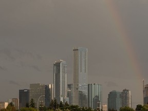 A rainbow is seen over downtown as a thunderstorm rolls through the city in Edmonton, on Friday, Aug. 2, 2019. Photo by Ian Kucerak/Postmedia