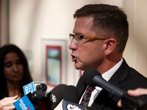 Coun. Tim Cartmell speaks about Edmonton City Council's discussions of regulation of AirBnB and other short term rentals outside of council chambers at City Hall in Edmonton, on Tuesday, Aug. 20, 2019.