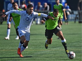 FC Edmonton Ramon Soria Alonso (5) tries to keep up with York9 FC Ryan Telfer (R) battle for the ball during action in the Canadian Premier League at Clarke Field in Edmonton, August 25, 2019. Ed Kaiser/Postmedia