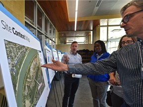 Senior Planner Rod Heinricks points out information to Edmontonians who were invited to a session to learn more about the proposed zoning changes related to a nordic spa near Fort Edmonton Park, at the Whitemud Equine Learning Centre in Edmonton, September 4, 2019. Ed Kaiser/Postmedia