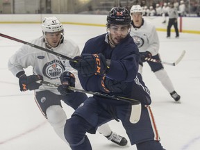 Tomas Jurco skates into the corner followed closely by Keegan Lowe. Oilers scrimmage at the Downtown Community Rink as part of the Edmonton Oilers training camp on September 15, 2019.