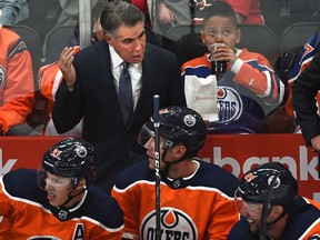 Edmonton Oilers head coach Dave Tippett talks to his players while playing the Calgary Flames during NHL pre-season action on Sept. 20, 2019, at Rogers Place.