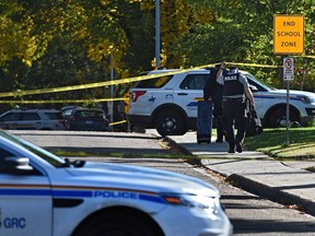 Yellow tapes surrounds a scene where RCMP investigate an officer shooting at a residence along Pine Street in Sherwood Park, September 23, 2019.