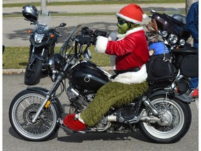 The Grinch on wheels at the 36th Annual Edmonton Toy Run, it's the annual kick-off for Santas Anonymous. They are expecting over 2000 motorcyclists to participate in this year's ride ending up in Hawrelak Park in Edmonton, September 29, 2019. Ed Kaiser/Postmedia