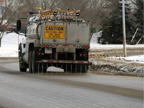 An anti-icing truck applies calcium chloride in Edmonton.