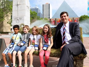 Mayor Don Iveson with Grade one students from Michael A. Kostek School in 2015. The City of Edmonton is moving forward on providing a child care service inside city hall during public meetings. Postmedia, File