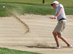 Tom Fuhr from Stony Plain hits out of a sand trap on his way to losing on in double playoff during the McLennan Ross Sun Junior Golf Tour at the Edmonton.