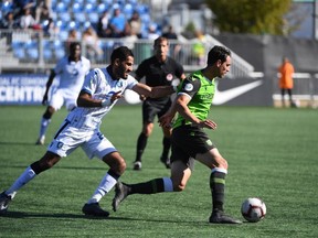 FC Edmonton midfielder Ajay Khabra, left, chases York9 midfielder Joseph Di Chiara during Canadian Premier League play at Clarke Field in Edmonton on Saturday, Sept. 21, 2019.