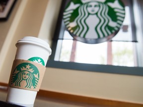 A Starbucks coffee cup is seen inside a Starbucks Coffee shop in Washington, DC, April 17, 2018.