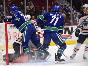Vancouver Canucks forward Brandon Sutter (20) crashes into the net of Edmonton Oilers goaltender Shane Starrett (40) after an rush on goal and is awarded a penalty shot during the first period at Rogers Arena.