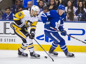 Toronto Maple Leafs Morgan Rielly during 1st period action against the Pittsburgh Penguins' Riley Sheahan at the Air Canada Centre in Toronto, Ont. on Saturday March 10, 2018.