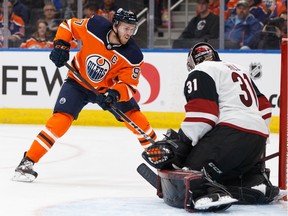 Edmonton Oilers' Connor McDavid (97) is stopped by Arizona Coyotes' goaltender Adin Hill (31) during the second period of a NHL preseason game at Rogers Place in Edmonton on Tuesday, Sept. 24, 2019.