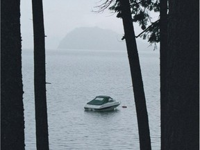 Lake neighbours make all the difference at B.C.’s Shuswap Lake, where a thin haze is on the mountain and boats are moored near shore at the end of summer, says columnist Cam Tait.