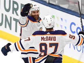 Zack Kassian and Connor McDavid of the Edmonton Oilers celebrate a second period goal by Kassian during their game against the New York Islanders at the NYCB's LIVE Nassau Coliseum on Oct. 8, 2019 in Uniondale, N.Y.