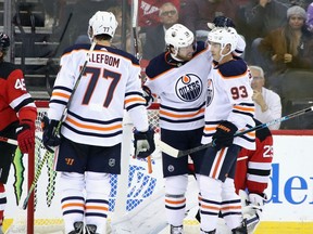 NEWARK, NEW JERSEY - OCTOBER 10: Ryan Nugent-Hopkins #93 of the Edmonton Oilers celebrates his goal with James Neal #18 after scoring at 19:32 of the second period on the power-play against the New Jersey Devils at the Prudential Center on October 10, 2019 in Newark, New Jersey.