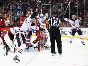 NEWARK, NEW JERSEY - OCTOBER 10: The Edmonton Oilers celebrate the game tying goal at 18:54 of the third period against the New Jersey Devils at the Prudential Center on October 10, 2019 in Newark, New Jersey. The Oilers defeated the Devils 4-3 in the shoot-out.