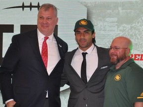 Diego Jair Viamontes, a receiver with the Mayas of the Liga de Futbol Americano Profesional, poses with Canadian Football League commissioner Randy Ambrosie, left, and Edmonton Eskimos player personnel director David Turner, right, after becoming the first-overall selection in the inaugural CFL-LFA draft Monday in Mexico City. (Dan Barnes/Postmedia)