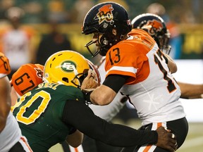 Edmonton Eskimos' Almondo Sewell (90) sacks BC Lions' quarterback Mike Reilly (13) during the second half of a CFL football game at Commonwealth Stadium in Edmonton, on Friday, June 21, 2019. Photo by Ian Kucerak/Postmedia