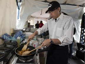 Blue Willow Restaurant supervisor, Zheoru Cheng prepares a dish of cumin shredded potato at the Taste of Edmonton's 35th Year Festival Anniversary on Thursday, July 18, 2019 in Edmonton . Taste of Edmonton is at Capital Plaza with over 50 local restaurants, food trucks and beverages . There are 20 new menu items to try this year. Taste of Edmonton also has an all-Canadian entertainment lineup nearly every evening.