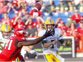 Calgary Stampeders Cordarro Law pressures Edmonton Eskimos QB, Trevor Harris in second half CFL action at McMahon stadium in Calgary on Saturday, August 3, 2019.