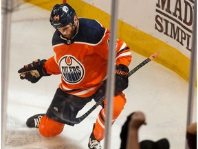 Edmonton Oilers' Zack Kassian (44) celebrates a goal with teammates on Vancouver Canucks' goaltender Jacob Markstrom (25) during third period NHL action at Rogers Place in Edmonton, on Wednesday, Oct. 2, 2019.