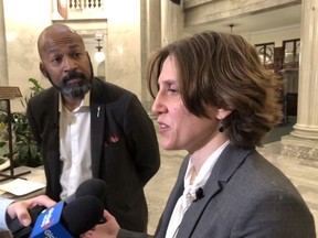 Dr. Cheryl Mather (right) and NDP MLA David Shepherd (left) explain concerns with aging medical lab equipment at Edmonton hospitals. The two spoke with reporters on Friday, Oct. 11, 2019, at the Alberta legislature in Edmonton.