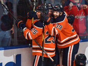 Edmonton Oilers Connor McDavid (97) celebrate his tying goal with Darnell Nurse (25) and Alex Chiasson (39) against the Washington Capitals during NHL action at Rogers Place in Edmonton, October 24, 2019. Ed Kaiser/Postmedia