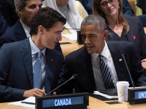 U.S. President Barack Obama (R) speaks with Canadian Prime Minister Justin Trudeau during a Refugee Summit on the sidelines of the 71st United Nations General Assembly inNew York on September 20, 2016.