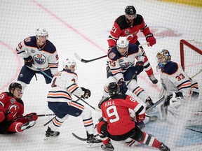 Players vie at Edmonton Oilers' Cam Talbots goal during the season-opening NHL Global Series ice hockey match between Edmonton Oilers and New Jersey Devils at Scandinavium in Gothenburg, Sweden, on October 6, 2018.