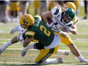 University Alberta Golden Bears' Jayden Dalke (2) Jassen Brown (41) tackle the University of Saskatchewan Huskies' Josh Ewanchyna (1) during first half Canada West action at Foote Field, in Edmonton Saturday Sept. 21, 2019.