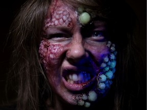 Fort Edmonton Park's Laura Nichol poses for a photo wearing partially glow in the dark horror makeup at Fort Edmonton Park, in Edmonton Thursday Oct. 10, 2019.