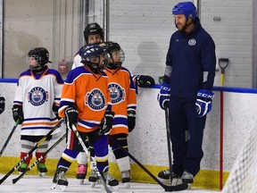 Former Edmonton Oilers forward Fernando Pisani works with players at the Oilers Hockey Institute at the Downtown Community Arena in Edmonton.