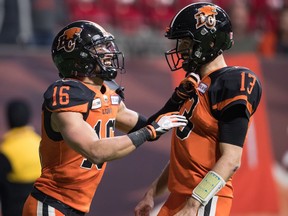 CP-Web.  B.C. Lions' Bryan Burnham, left, and quarterback Mike Reilly celebrate Burnham's second touchdown during first half CFL football action against the Toronto Argonauts, in Vancouver, Saturday, Oct. 5, 2019.