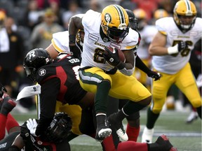 Eskimos running back C.J. Gable (2) jumps past Ottawa Redblacks defensive lineman George Uko (92) during first half CFL football action in Ottawa on Saturday, Sept. 28, 2019.