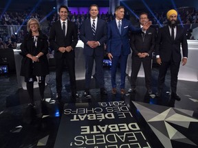 CP-Web.  Federal party leaders Green Party leader Elizabeth May, Liberal leader Justin Trudeau, Conservative leader Andrew Scheer, People's Party of Canada leader Maxime Bernier, Bloc Quebecois leader Yves-Francois Blanchet and NDP leader Jagmeet Singh pose for a photograph before the Federal leaders debate in Gatineau, Que. on Monday, October 7, 2019.
