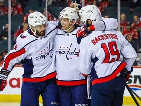 Washington Capitals defenceman John Carlson (74) celebrates his goal with teammates against the Calgary Flames during the second period at Scotiabank Saddledome on Tuesday, Oct. 22, 2019.