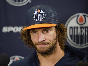 Edmonton Oilers goalie Mike Smith talks to reporters in Edmonton on Thursday, Oct. 3, 2019, the day after his team won their season opening game against the Vancouver Canucks.
