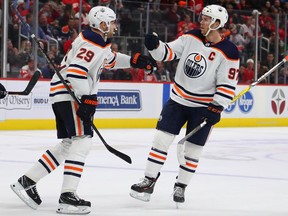 Leon Draisaitl of the Edmonton Oilers, left, celebrates his third-period goal with teammate Connor McDavid while playing the Detroit Red Wings at Little Caesars Arena on Oct. 29, 2019 in Detroit.