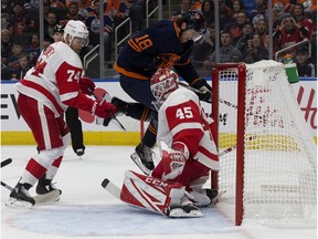 Edmonton Oilers winger James Neal battles the Detroit Red Wings' defenceman Madison Bowey and goalie Jonathan Bernier during NHL action on Oct. 18, 2019, at Rogers Place.