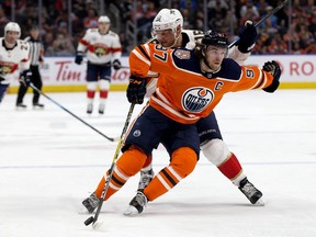 The Edmonton Oilers' Connor McDavid (97) battles the Florida Panthers' Aleksander Barkov (16) during second period NHL action at Rogers Place, in Edmonton Thursday Jan. 10, 2019. Photo by David Bloom