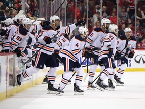 Edmonton Oilers players celebrate a shoot-out win over the New Jersey Devils on Oct. 10, 2019, at the Prudential Center in Newark, N.J.