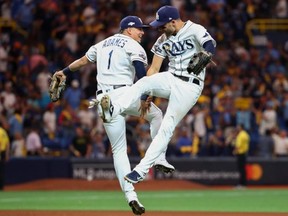 Rays shortstop Willy Adames (1) and centre fielder Kevin Kiermaier (39) celebrate their win over the Astros in Game 4 of the ALDS at Tropicana Field in St. Petersburg, Fla., on Tuesday, Oct. 8, 2019.