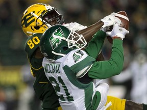 The Saskatchewan Roughriders' L.J. McCray (21) makes an interception catch against the Edmonton Eskimos' DaVaris Daniels (80) during third quarter CFL action at Commonwealth Stadium in Edmonton Saturday Oct. 26, 2019. Saskatchewan won 27 to 24.