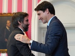 Canadian Prime Minister Justin Trudeau congratulates Steven Guilbeault
