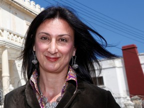 Maltese investigative journalist Daphne Caruana Galizia poses outside the Libyan Embassy in Balzan, Malta April 6, 2011. (REUTERS/Darrin Zammit Lupi/File Photo)