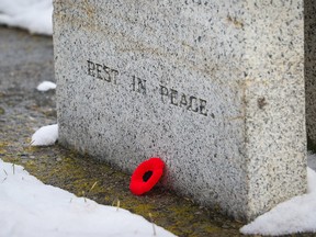 Christina Ryan, Calgary Sun, Calgary, Alberta: NOVEMBER 04, 2019 - During the No Stone Left Alone ceremony at the Union cemetery, people, including students place a poppy at each soldier's headstone in an act of remembrance, on November 4, 2019. (Christina Ryan/Calgary Sun) (For News section story by ) Trax#