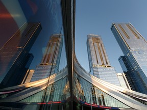 The Stantec Tower and JW Marriott hotel buildings are seen as the sun sets outside of an Edmonton Oil Kings and Brandon Wheat Kings WHL hockey game at Rogers Place in Edmonton, on Sunday, Nov. 17, 2019. Photo by Ian Kucerak/Postmedia