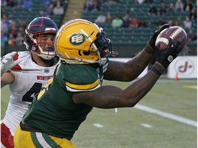 Edmonton Eskimos C.J. Gable eludes a tackle by Montreal Alouettes Jean-Gabriel Poulin to make a touchdown reception during CFL game action at Commonwealth Stadium in Edmonton on Friday June 14, 2019.