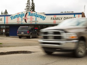 Landlord Kelly Scott poses for a photo outside the strip mall he owns at 87 Avenue and 159th Street that includes Flamingo Restaurant in Edmonton, on Monday, July 8, 2019. The City of Edmonton wishes to use the land up to where Scott is standing for LRT development. Photo by Ian Kucerak/Postmedia
