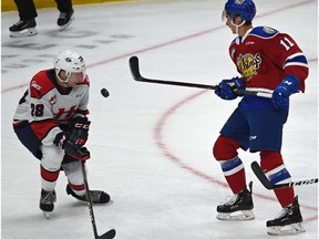 Edmonton Oil Kings Dylan Guenther (11) flips the puck towards the net past Lethbridge Hurricanes Alex Cotton (28) during WHL action at Rogers Place in Edmonton, September 29, 2019.
